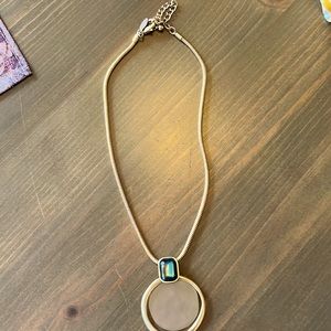 Goldtone disk necklace with green stone